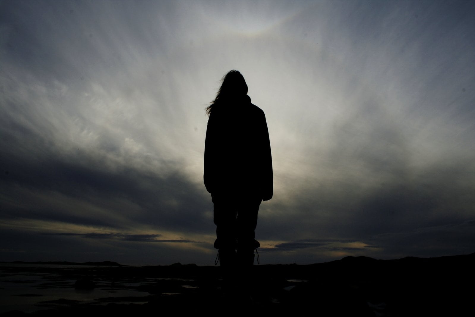 woman standing in a gray storm