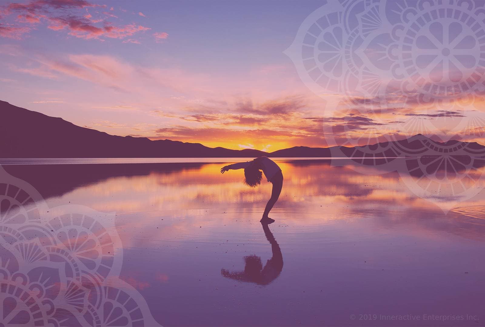 woman doing yoga in water at sunset