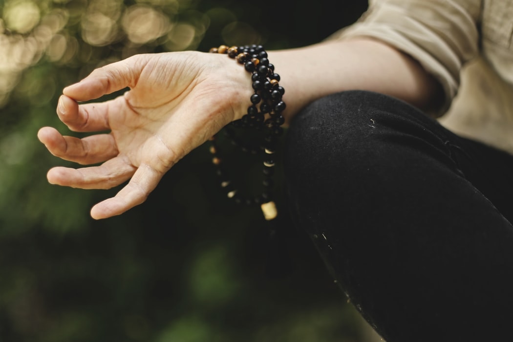 image of hand of a woman who is meditating